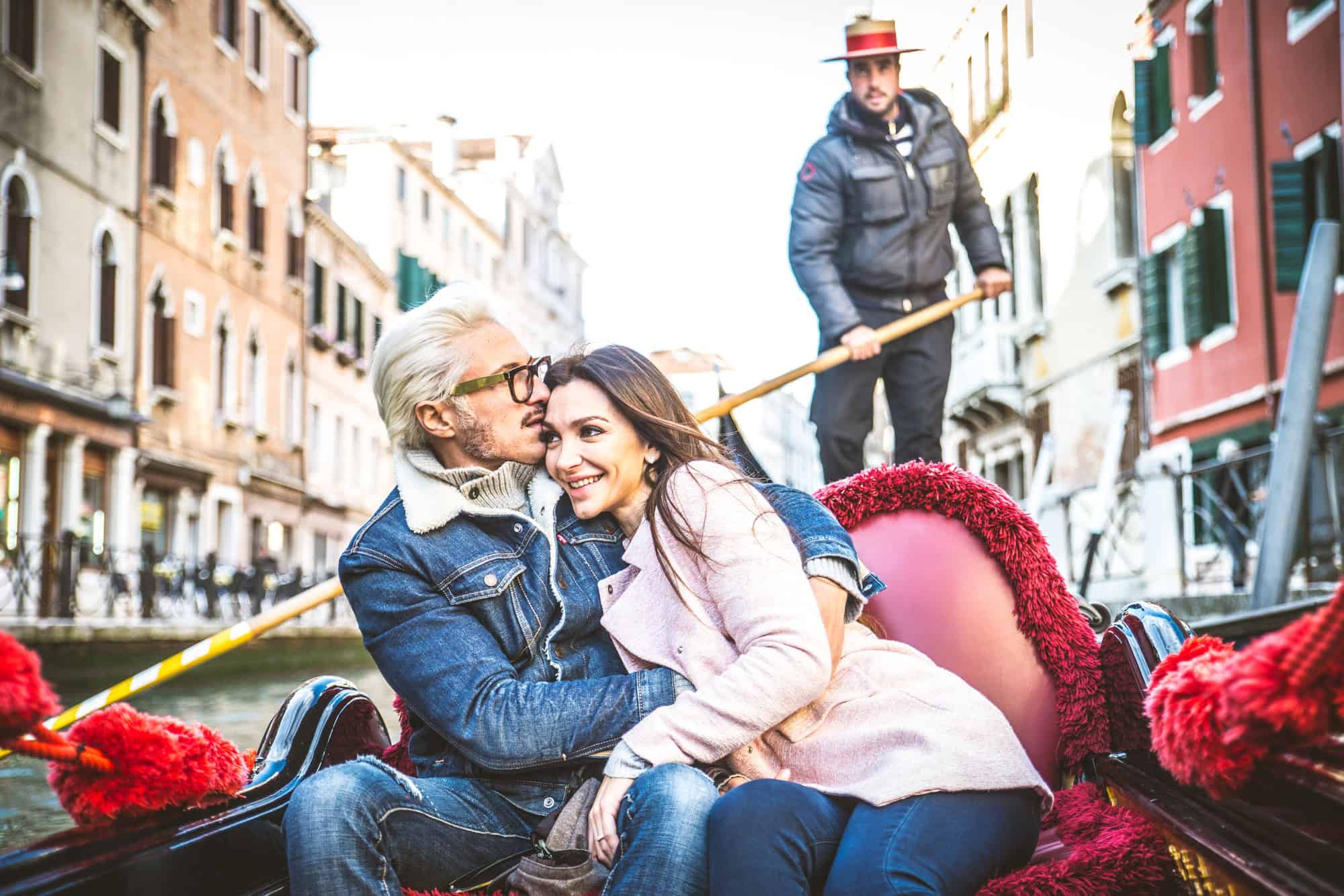 Couple sailing on venetian gondola